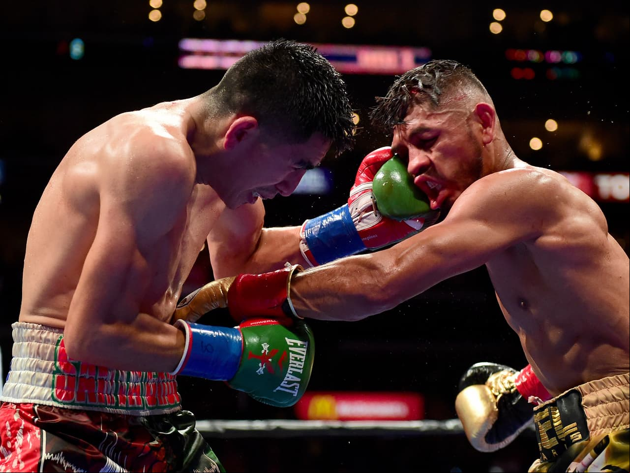 LOS ANGELES, CA - AUGUST 29: Leo Santa Cruz punches Abner Mares of Mexico during the ninth round of the WBC diamond featherweight and WBA featherweight championship bout at Staples Center on August 29, 2015 in Los Angeles, California. Santa Cruz would win in a 12 round decision. (Photo by Harry How/Getty Images)