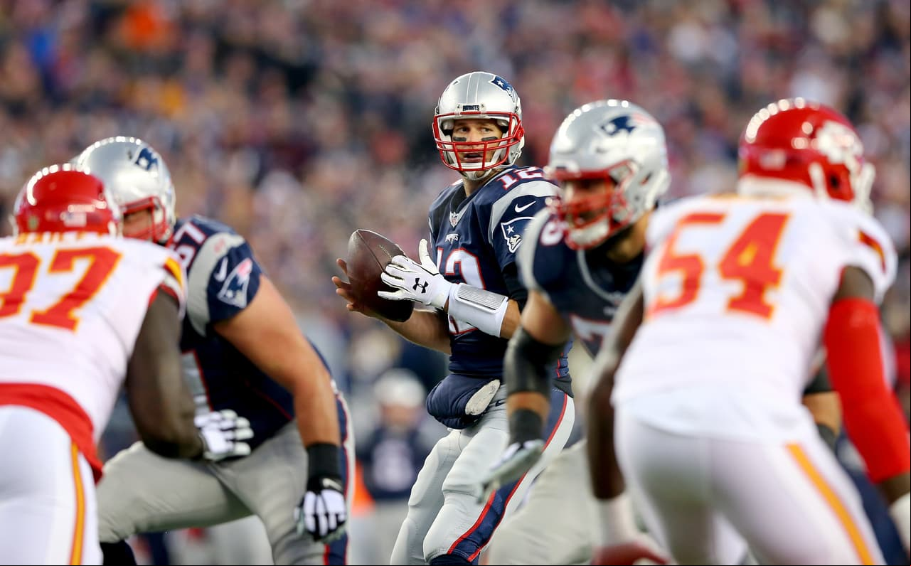 FOXBORO, MA - JANUARY 16: Tom Brady #12 of the New England Patriots looks to  in the first quarter against the Kansas City Chiefs during the AFC Divisional Playoff Game at Gillette Stadium on January 16, 2016 in Foxboro, Massachusetts. (Photo by Elsa/Getty Images)