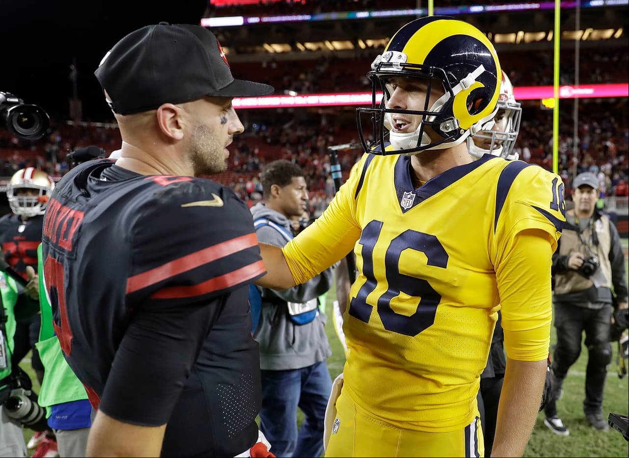 Los Angeles Rams quarterback Jared Goff, right, greets San Francisco 49ers quarterback Brian Hoyer after an NFL football game in Santa Clara, Calif., Thursday, Sept. 21, 2017. The Rams won 41-39. (AP Photo/Marcio Jose Sanchez)