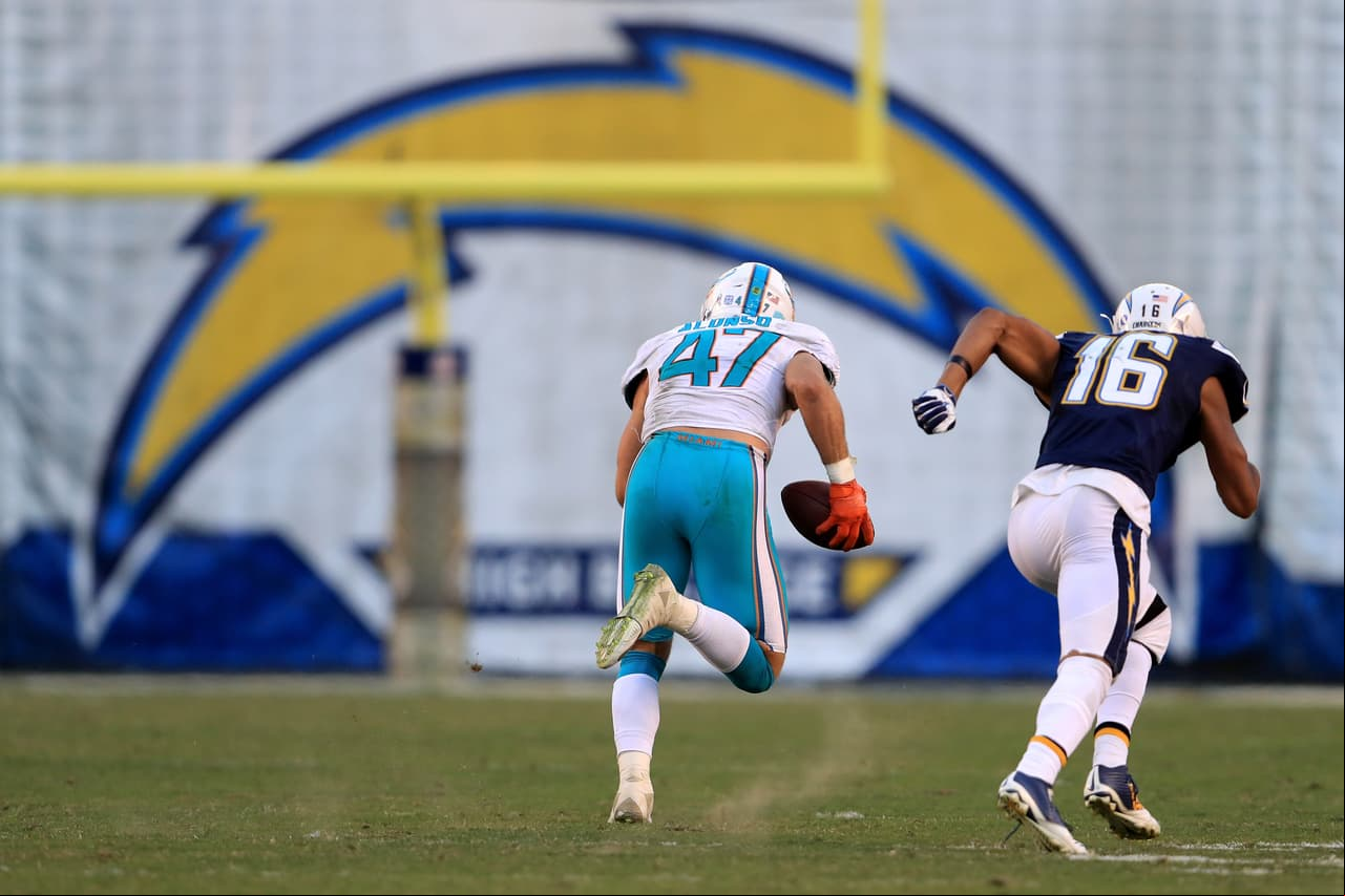 SAN DIEGO, CA - NOVEMBER 13: Kiko Alonso #47 of the Miami Dolphins intercepts and returns it for a touchdown as Tyrell Williams #16 of the San Diego Chargers chases during the second half of a game at Qualcomm Stadium on November 13, 2016 in San Diego, California. (Photo by Sean M. Haffey/Getty Images)