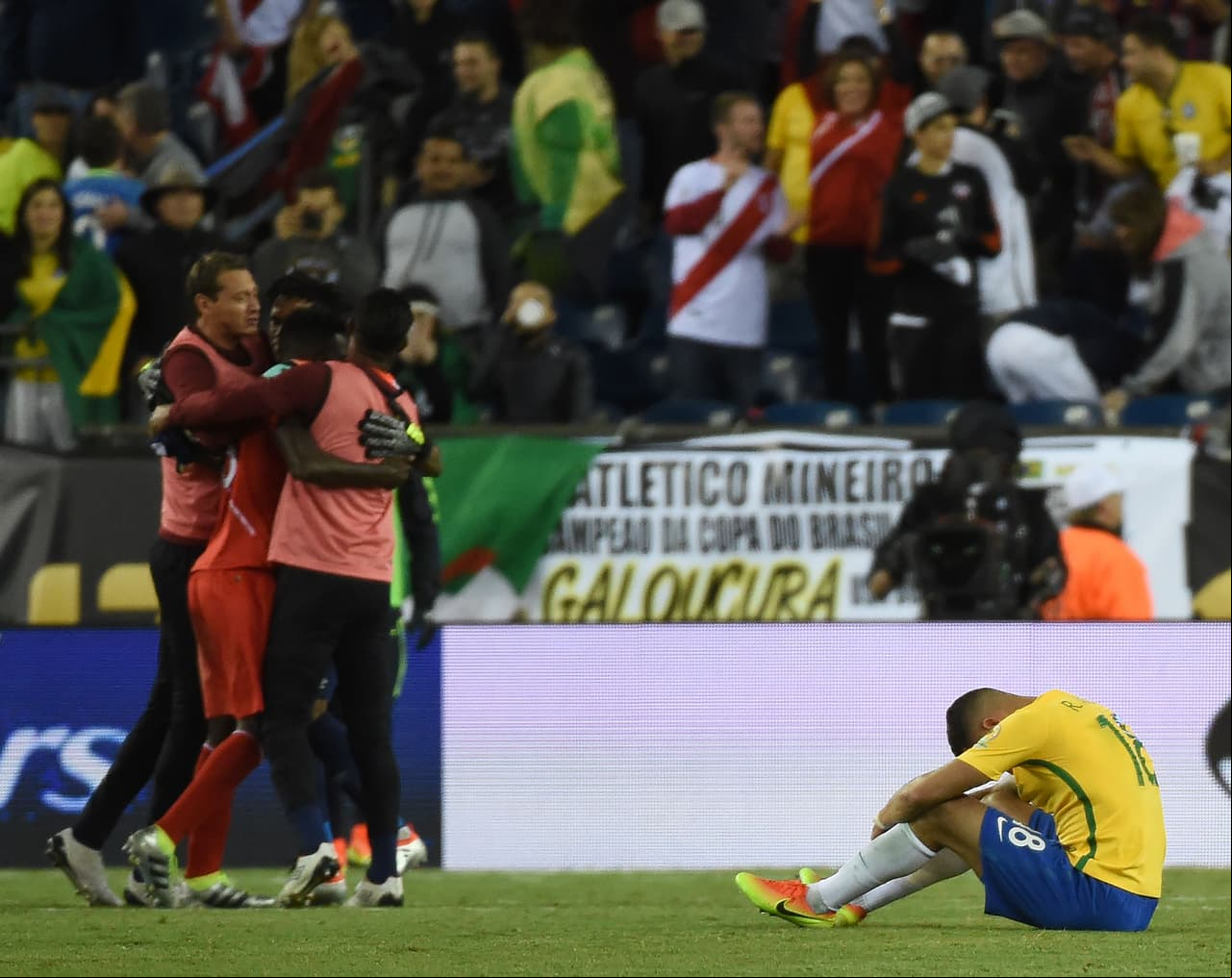 TOPSHOT -  of Peru's national team (in red) celebrate after defeating Brazil in their Copa America Centenario football tournament match in Foxborough, Massachusetts, United States, on June 12, 2016. / AFP / Timothy A. CLARY (Photo credit should read TIMOTHY A. CLARY/AFP/Getty Images)