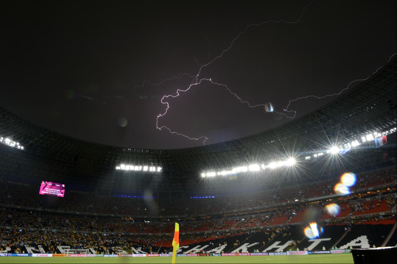 A lighting is pictured as the Euro 2012 championships football match Ukraine vs  is suspended due to heavy rainfall on June 15, 2012 at the Donbass Arena in Donetsk. AFP PHOTO/ FRANCK FIFE (Photo credit should read FRANCK FIFE/AFP/GettyImages)