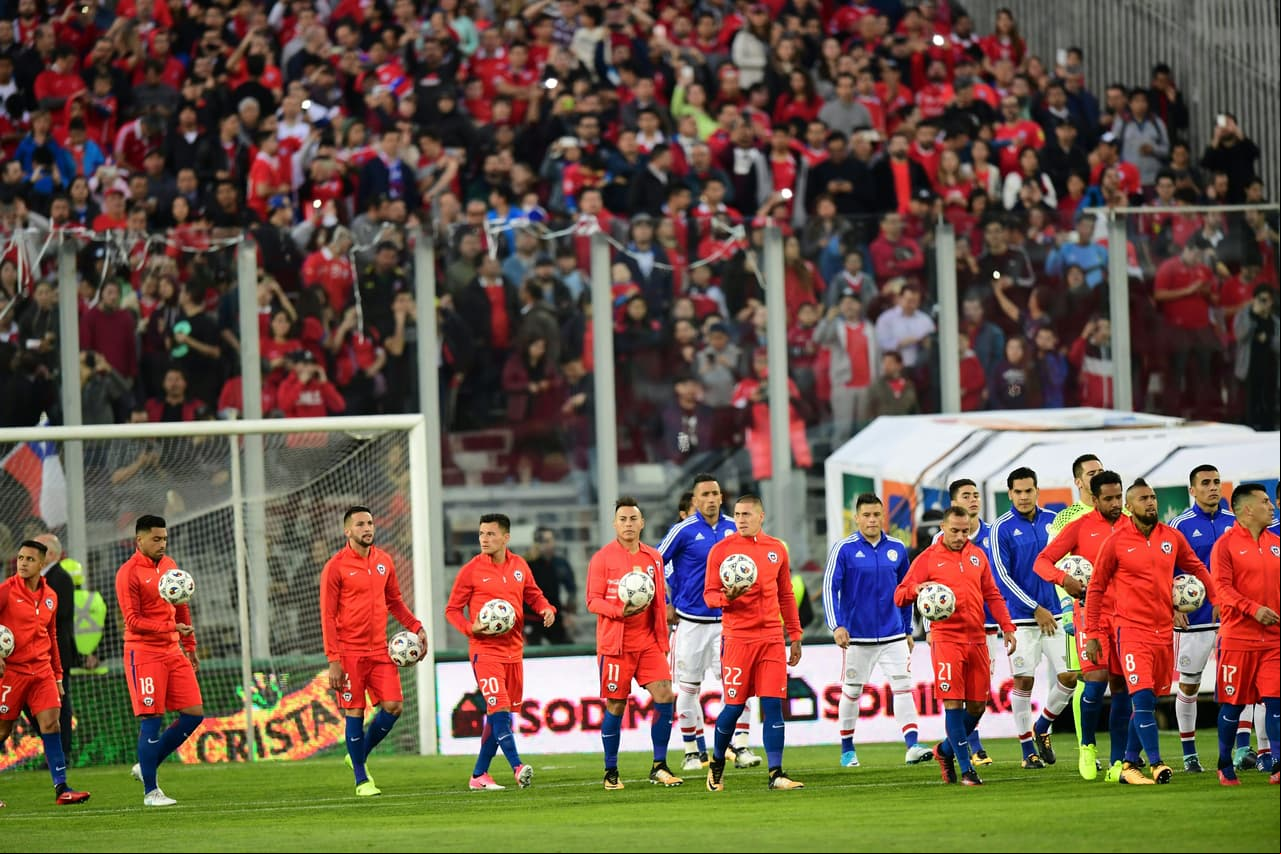 Players of Chile warm-up before the start of their 2018 World Cup football qualifier match against Paraguay, in Santiago, on August 31, 2017. / AFP PHOTO / Martin BERNETTI (Photo credit should read MARTIN BERNETTI/AFP/Getty Images)